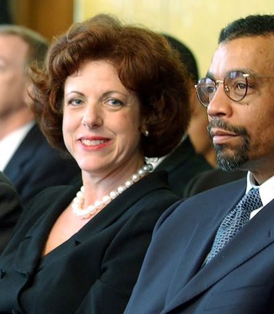 FILE - In this April 12, 2002, file photo U.S. District Judge Susan Dlott, left, sits with attorney Billy Martin in Cincinnati. Dlott lifted minority and female hiring quotas imposed on the Cincinnati police department 40 years ago to fix the department's lack of diversity. She said in a Wednesday, Sept. 15, 2021, ruling that the provisions put in place city in 1981 no longer pass constitutional muster. She also said Cincinnati has failed to provide any evidence that the race-based hiring and promotional goals are continuing to remedy past discrimination or its lingering effects.  (Gary Landers)