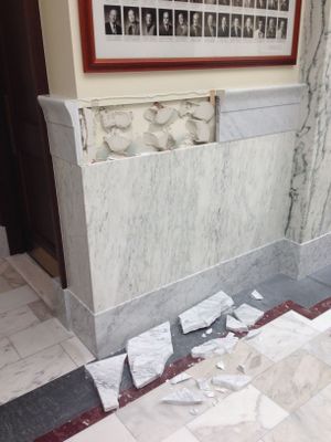A 2-foot section of marble wainscoting trim in a wing of the Idaho state Capitol crashed to the floor this week, after a 5-year-old girl reached up and put her hands on the small ledge. (Betsy Z. Russell)