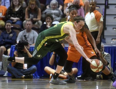 Seattle Storm forward Brianna Stewart chases a loose ball against Connecticut Sun forward Alyssa Thomas during the first half of a WNBA basketball game at the Mohegan Sun Arena in Uncasville, Conn., Tuesday, Aug. 8, 2017. (Tim Martin / Associated Press)