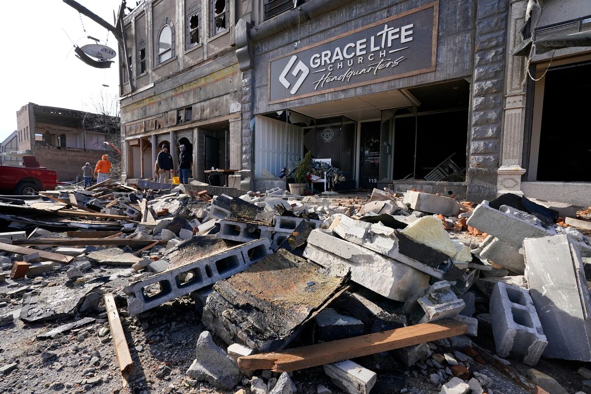 Damage from a tornado is seen in downtown Mayfield, Ky. on Saturday, Dec. 11, 2021. Tornadoes and severe weather caused catastrophic damage across multiple states late Friday, killing several people overnight.  (Mark Humphrey)