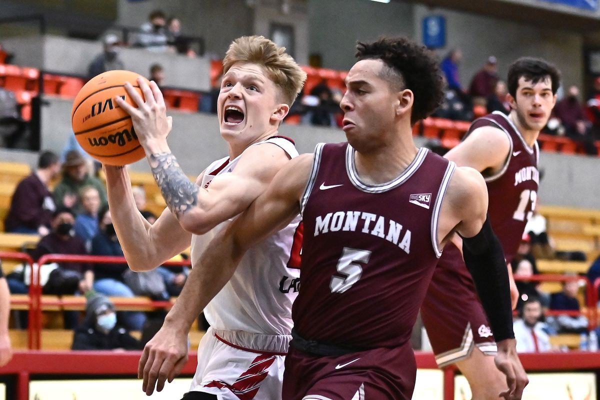 Eastern Washington Eagles guard Mason Landdeck (24) shoots the ball against Montana Grizzlies guard Robby Beasley III (5) in the first half a Big Sky basketball game at Reese Court on Thursday, Jan. 6, 2022 in Spokane WA.  (James Snook For The Spokesman-Review)