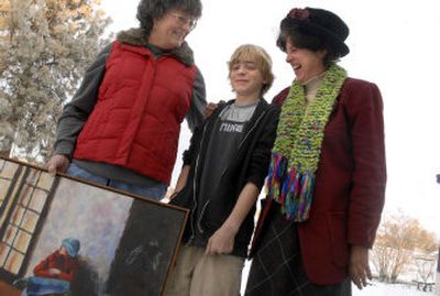 
Artists Janet Adams, left, and Zeke Flack, 12, share a laugh with Elaine Rising, owner of On Sacred Grounds coffee shop in Valleyford during a portrait shoot at the coffee shop. Rising will host an amateur art show at her coffee shop Jan. 10 to Feb. 7
 (Jed Conklin / The Spokesman-Review)