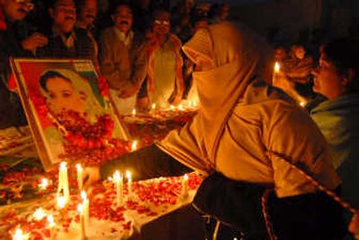 
Supporters of Pakistan's slain opposition leader Benazir Bhutto participate in a candlelight ceremony in Multan, Pakistan on Monday.  Elections in Pakistan look set to be delayed by several weeks. Associated Press
 (Associated Press / The Spokesman-Review)