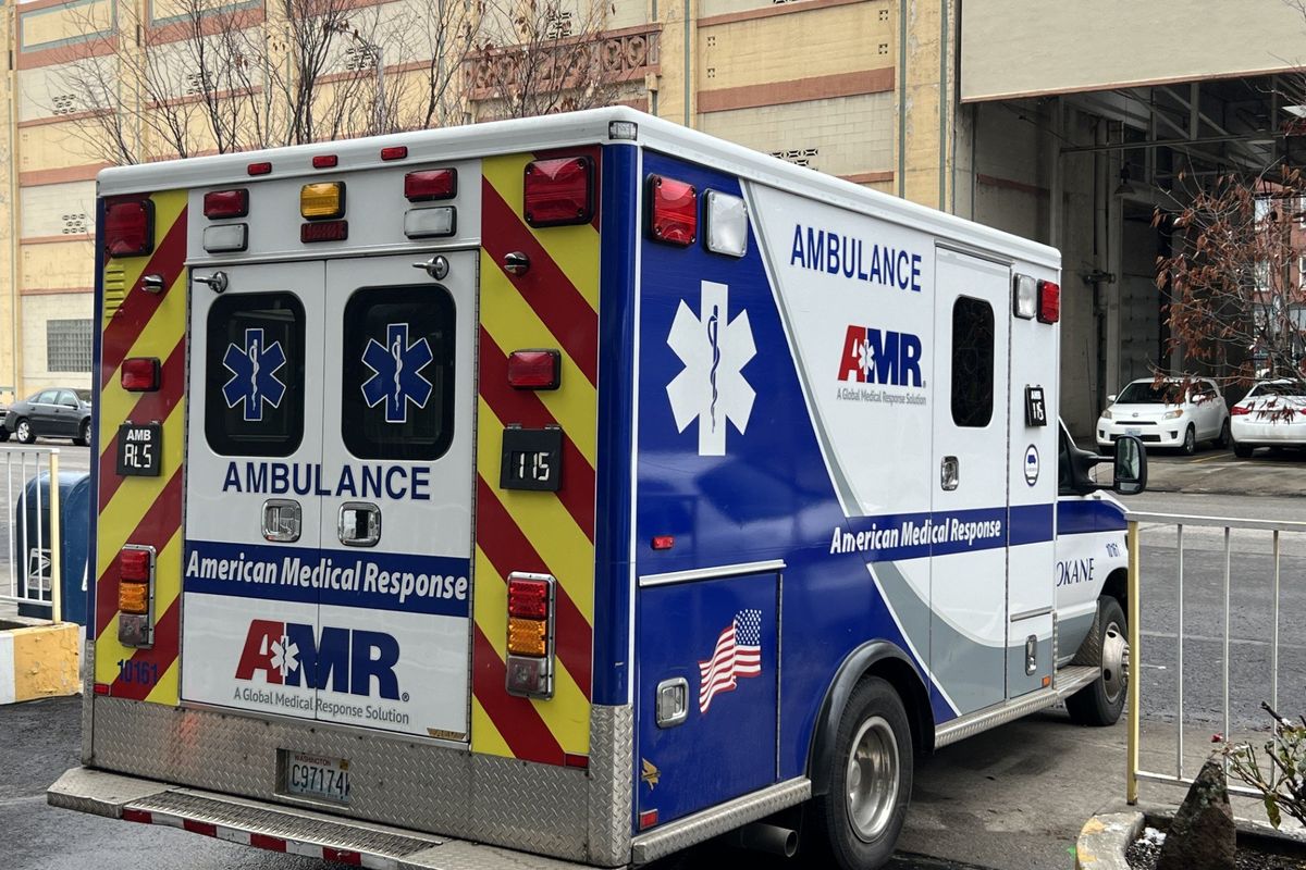 An American Medical Response ambulance arrived at Cathedral Plaza Apartments, 1120 W. Sprague Ave., to transport a resident on Jan. 8, 2025. AMR