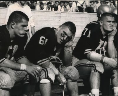 Jerry Campbell (61) with Idaho teammates Steve Baratto (51) and Stan Baratto (71) in 1964. (The Spokesman-Review)