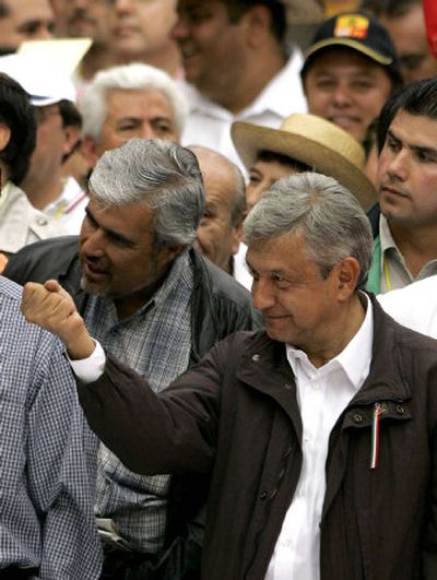 
Lopez Obrador gestures during a massive march  in Mexico City on Sunday. 
 (Associated Press / The Spokesman-Review)