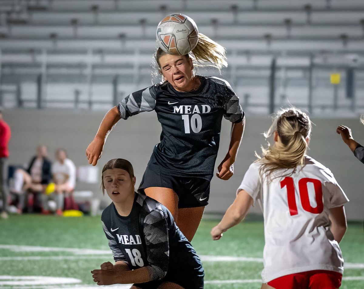 Soccer player heads ball on hi-res stock photography and images