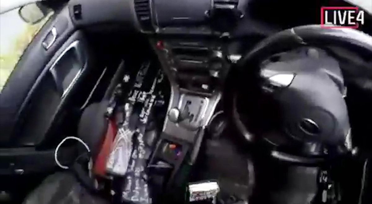 This frame from video that was livestreamed Friday, March 15, 2019, shows guns in the car of a gunman who used the name Brenton Tarrant on social media before the mosque shootings in Christchurch, New Zealand. (Associated Press)