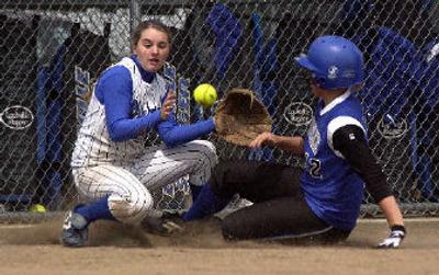 
Shortstop Lindsey Stark, left, a first-team, all-league selection, is back for Coeur d'Alene.
 (File / The Spokesman-Review)