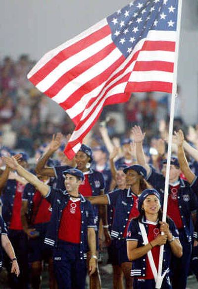 
Basketball player Dawn Staley leads the U.S. team into Olympic Stadium during opening ceremonies Friday in Athens. The first Olympics took place in Olympia in 776 B.C. 
 (Associated Press / The Spokesman-Review)