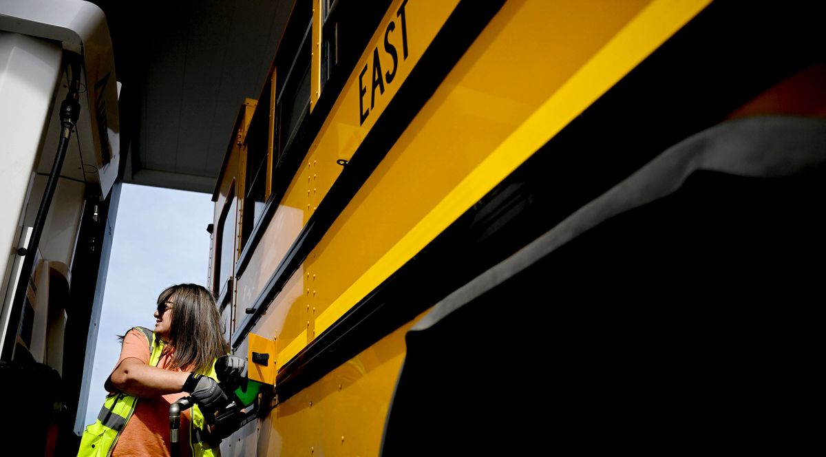 East Valley School District bus driver Amy Doller fuels up her rig at AmeriMart in Post Falls on Tuesday before her elementary school route. The district has been saving money by filling school bus tanks with diesel in Idaho. The closest station is about a mile from the closest elementary school.  (Kathy Plonka/The Spokesman-Review)