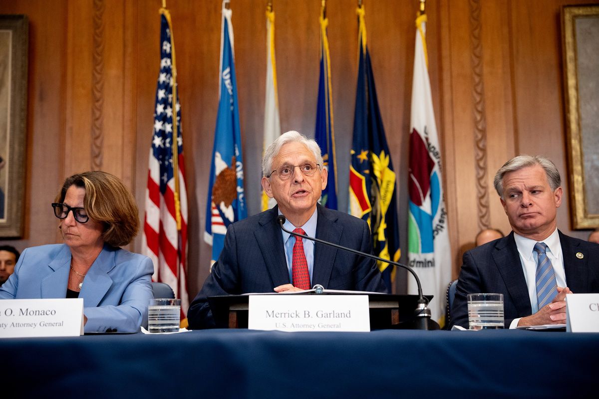 Attorney General Merrick Garland, center, accompanied by Deputy Attorney General Lisa Monaco, left, and FBI Director Christopher Wray, speaks at the Justice Department on Wednesday in Washington, D.C.  (Andrew Harnik)