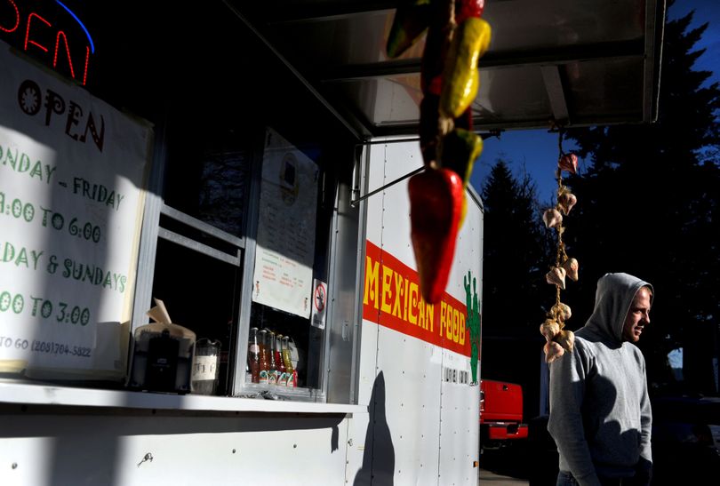 Matt Anderson stopped for lunch at El Chiludo taco truck in Coeur d’Alene on Wednesday. An Aryan Nations group picketed the stand recently. (Kathy Plonka)