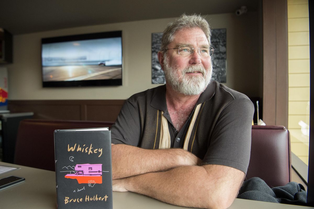 Author Bruce Holbert sits at the Logan Tavern last week. His third novel, “Whiskey” comes out Tuesday and will be celebrated with a book launch on Wednesday at Auntie’s Bookstore in Spokane. (Jesse Tinsley / The Spokesman-Review)