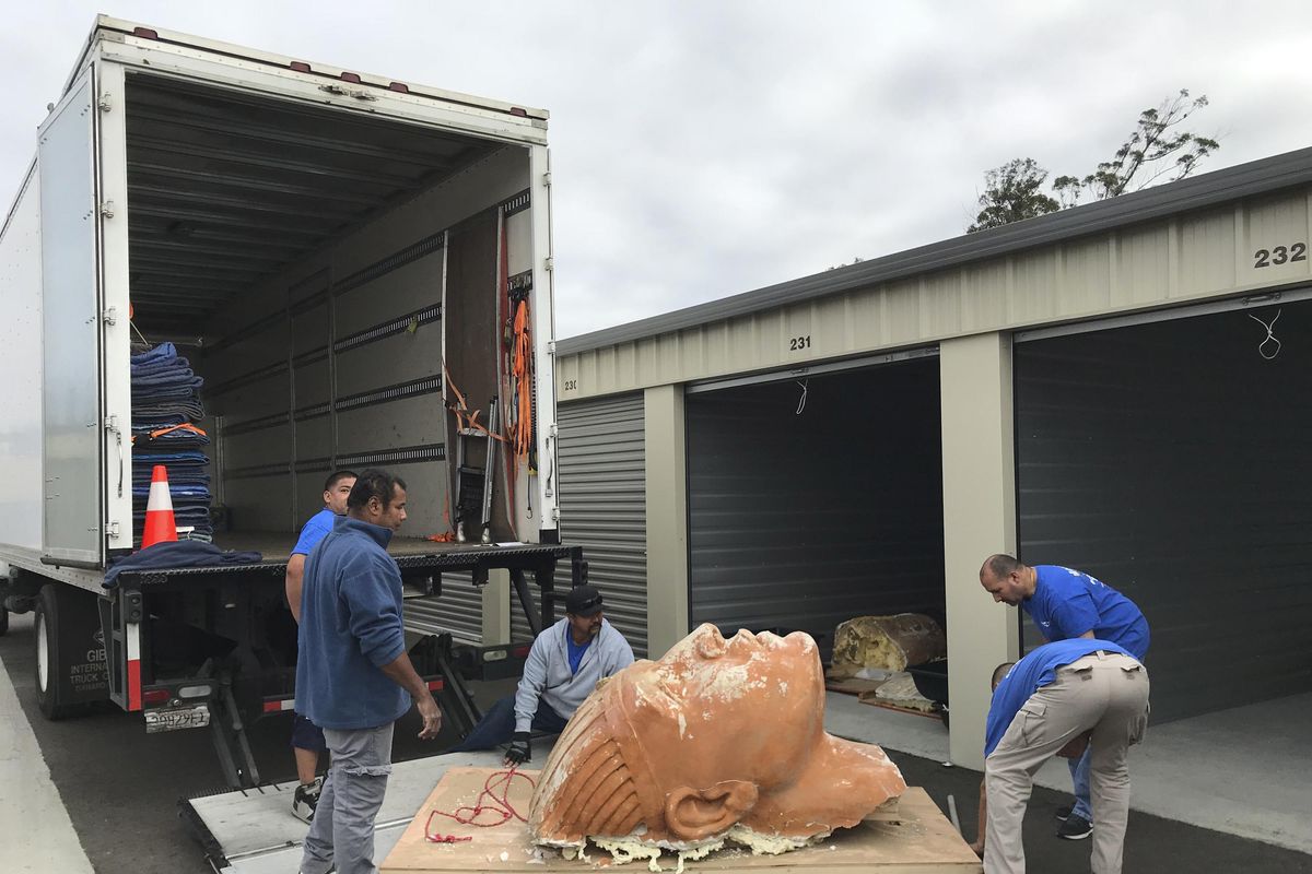 In this Nov. 8, 2017, photo provided by the Guadalupe-Nipomo Dunes Center, crews move an unearthed sphinx head into safekeeping, where it will be carefully restored in Guadalupe, Calif. Archaeologists working in sand dunes on the central California coast have dug up an intact plaster sphinx that was part of an Egyptian movie set built more than 90 years ago for filming of Cecil B. DeMille’s 1923 epic “The Ten Commandments.” The 300-pound sphinx is the second recovered from the Guadalupe-Nipomo Dunes. (Guadalupe-Nipomo Dunes Center via AP) (AP)