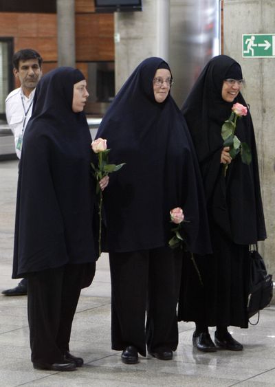 Cindy Hickey, left, Nora Shourd and Laura Fattal arrive at the Imam Khomeini airport outside Tehran, Iran, on Wednesday.  (Associated Press)