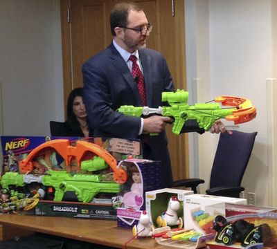 James Swartz, director of World Against Toys Causing Harm, or WATCH, displays Nerf’s “Zombie Strike” crossbow during a news conference Tuesday, Nov. 14, 2017, in Boston, where the child safety group released its annual holiday list of the 10 most hazardous toys. (Associated Press)