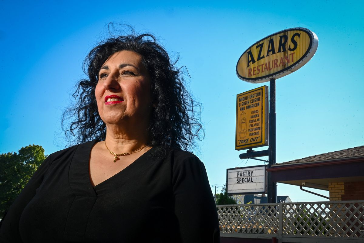 Katy Azar will be closing Azars Restaurant on Oct. 22, 2022., The Greek and Middle Eastern eatery has been in Spokane for 42 years, 32 years at the present location at 2501 N.. Monroe. She will take the middle part of the sign with her, while leaving to top for the new owners.  (DAN PELLE/THE SPOKESMAN-REVIEW)