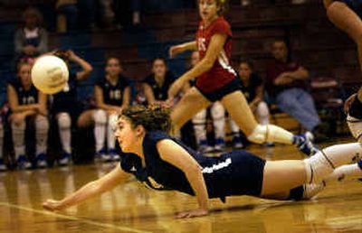 
Mt. Spokane's Krista Aspass dives to keep the ball in play against Shadle Park in a Greater Spokane League volleyball match won by Mt. Spokane in five games. 
 (Brian Plonka / The Spokesman-Review)