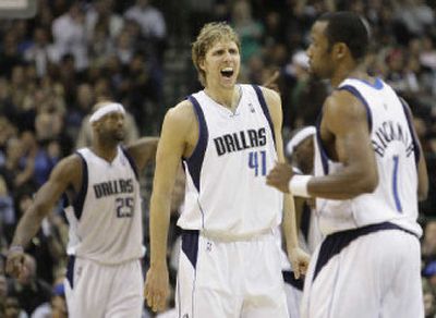 Dallas' Dirk Nowitzki, center, Greg Buckner, right, and Erick Dampier handed the Sonics their ninth straight road loss.
(Associated Press / The Spokesman-Review)