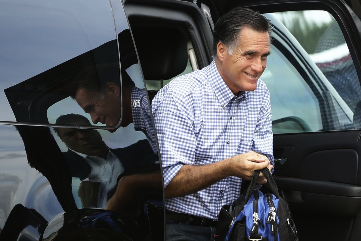 Republican presidential candidate and former Massachusetts Gov. Mitt Romney gets out of his vehicle before he boards his campaign plane in Orlando, Fla., Sunday, Oct. 7, 2012. (Charles Dharapak / Associated Press)