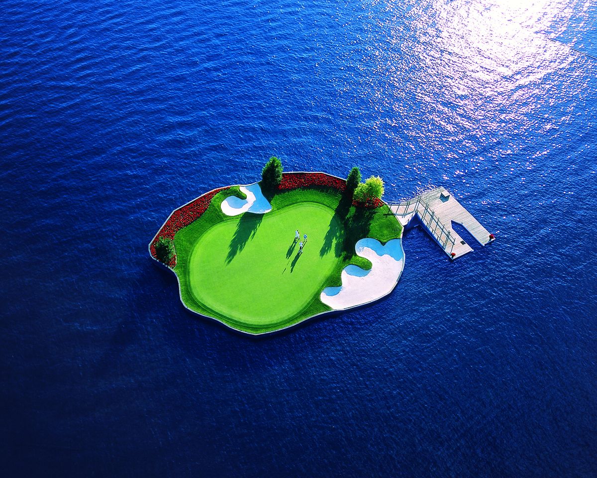 The floating tee and green for golfers is one of the unique attractions at the Coeur d’Alene Resort.  (Joel Riner)