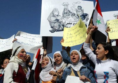 
Syrian girls demonstrate on Monday in Damscus, Syria, to protest the U.N. report on the assassination of former Lebanese Prime Minister Rafik Hariri that implicated Syrian and Lebanese officials. 
 (Associated Press / The Spokesman-Review)