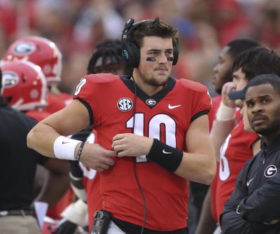 Former Georgia quarterback Jacob Eason (10) stands along the sideline during the first half of the team's NCAA college football game against Kentucky in Athens, Ga. (John Bazemore / AP)