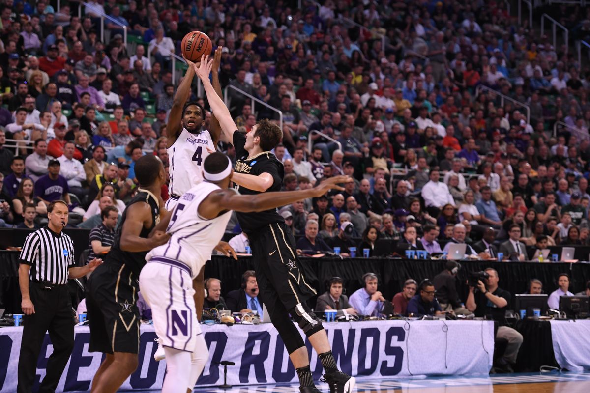 Northwestern Wildcats forward Vic Law (4) shoots the ball during the second half of a first round NCAA men