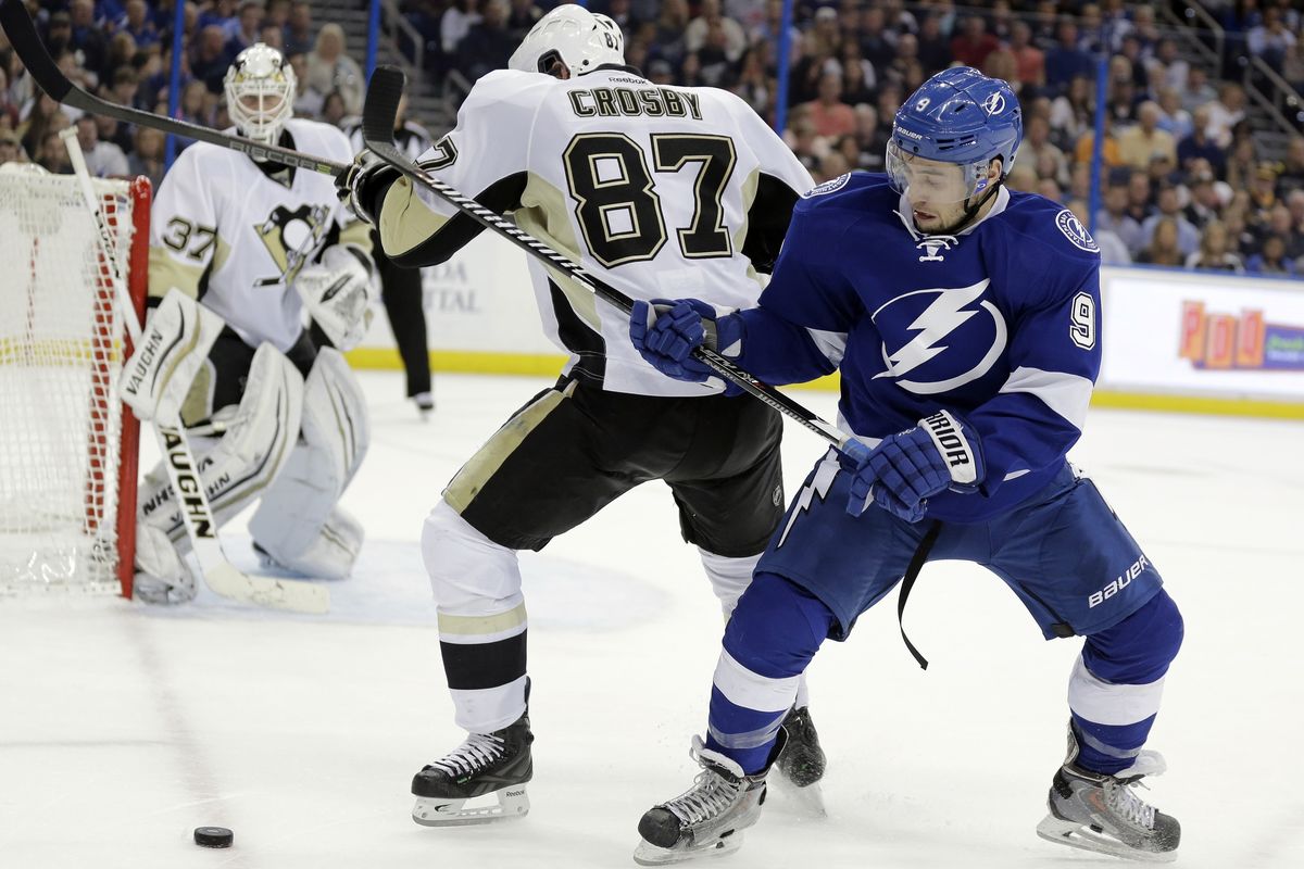 Tampa Bay Lightning center Tyler Johnson, right, mixes it up with fellow all-star center Sidney Crosby of the Penguins. (Associated Press)