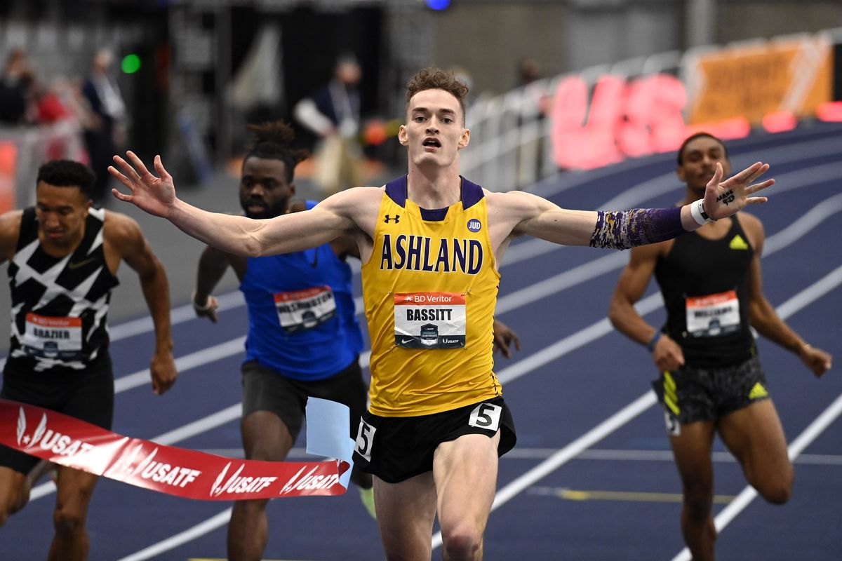 Trevor Bassitt crosses the finish line first with Donavan Brazier, far left, coming in second in the men’s 400-meter dash during the 2022 USATF Indoor Championships on Sunday at the Podium in Spokane.  (COLIN MULVANY/THE SPOKESMAN-REVIEW)
