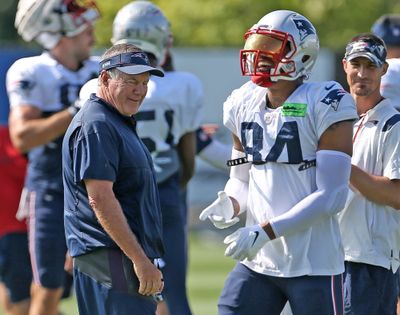 New England Patriots head coach Bill Belichick has a laugh with Kendrick Bourne during training camp at Gillette Stadium on August 2, 2022 in Foxboro, Massachusetts.   (Boston Herald)