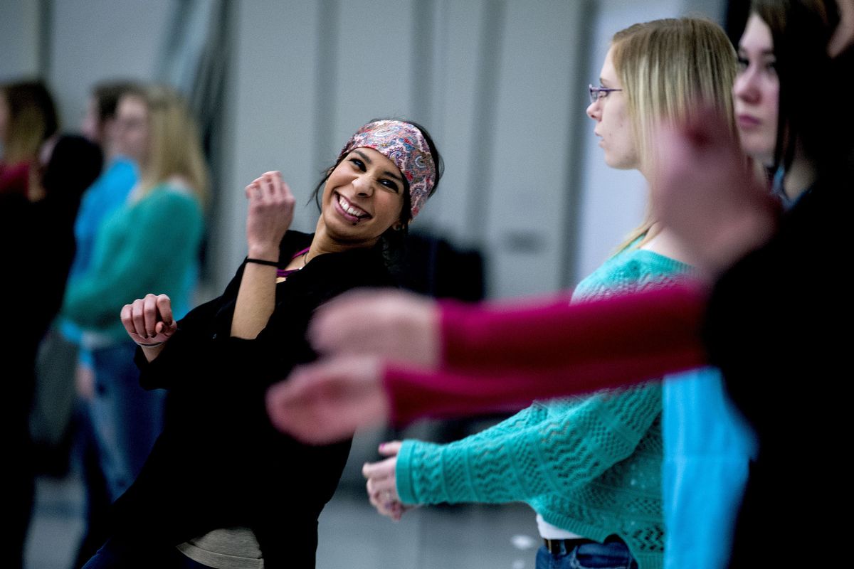 “It makes you feel comfortable in your own body,” said Coeur d’Alene High School senior Christine Harris, center, as she danced during advanced glee class on Wednesday. Several programs are on the chopping block as voters cast their school levy ballots. (Kathy Plonka)