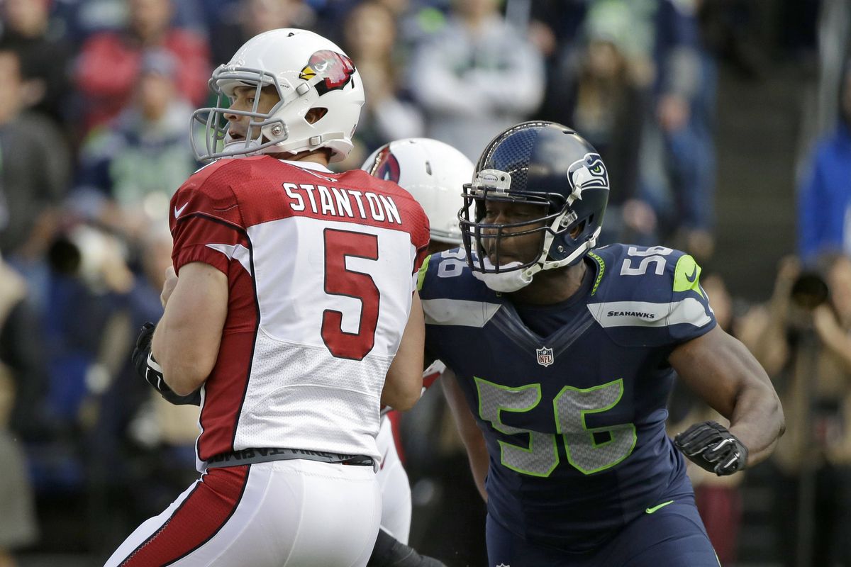 Seahawks defensive end Cliff Avril, right, signed four-year extension. (Associated Press)