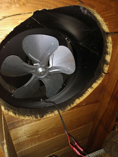 This is a powered roof ventilation fan. View is from inside the attic looking at the underside of the fan. (Tim Carter)