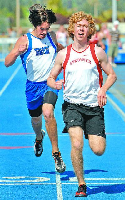 
Brian Angove of St. George's holds off Valley Christian's Jeff Pope in the boys 1,600-meter final. 
 (Jed Conklin / The Spokesman-Review)
