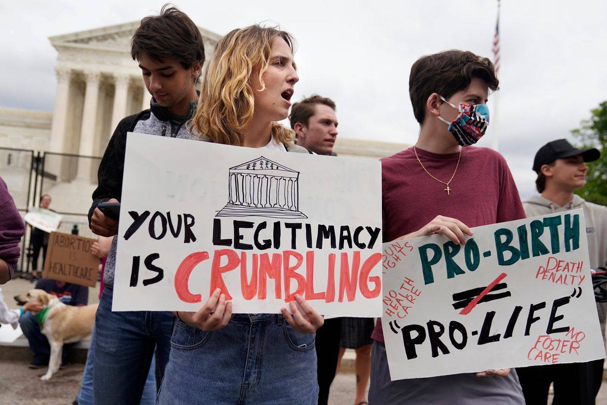 Demonstrators protest outside of the U.S. Supreme Court on Thursday in Washington, D.C.  (Mariam Zuhaib)