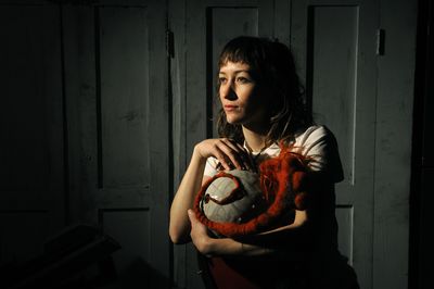 Artist Lydia Quinones used ceramics and wool to create the piece she holds titled “Wool 4” at Object Space on Sprague Avenue in Spokane. (Dan Pelle / The Spokesman-Review)