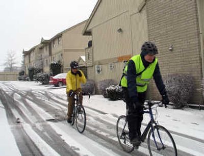 
Bike commuter Kevin Plummer, right, heads out on his six-mile trip to work last Thursday with John Speare, who has been compiling commuter data. 
 (Mike  Prager / The Spokesman-Review)