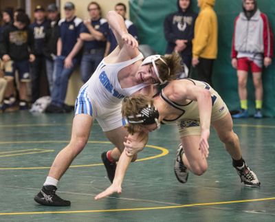 Central Valley’s Braedon Orrino, left, makes a move on Mead’s Cameron Crawford in the district final. (Dan Pelle / The Spokesman-Review)