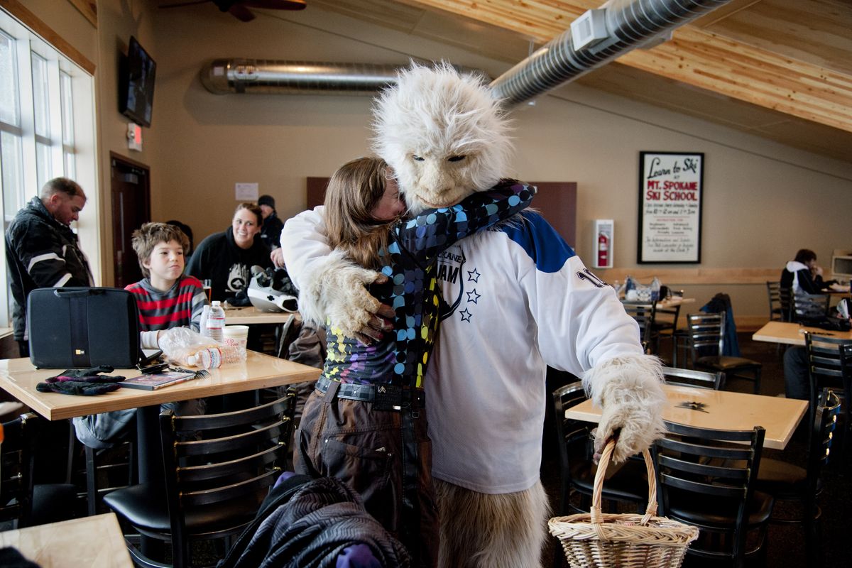 Bethany Desrosiers hugs the roving Yeti on Thursday in the new lodge addition at Mt. Spokane Ski and Snowboard Park. Desrosiers says she would like to have her summer wedding in the new facility. (Dan Pelle)