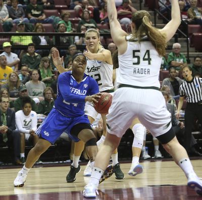 Buffalo's Cierra Dillard drives around South Florida's Maria Jespersen, center, and Alyssa Rader to attempt a shot in a first-round game of the NCAA women's college basketball tournament, Saturday, March 17, 2018, in Tallahassee, Fla. (Steve Cannon / Associated Press)