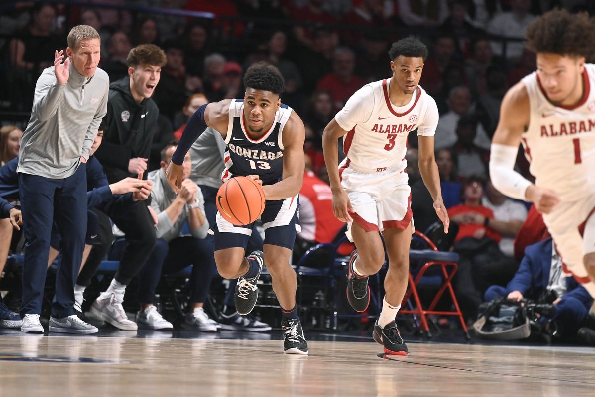 Gonzaga guard Malachi Smith (13) heads downcourt as Alabama guard Rylan Griffen (3) and guard Mark Sears (1) give chase during the first half of a NCAA college basketball game, Saturday, Dec.17, 2022, in Birmingham, Alabama.  (COLIN MULVANY/THE SPOKESMAN-REVIEW)