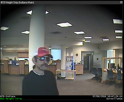 Security footage shows a suspect who allegedly robbed the Washington Trust Bank in North Spokane late Friday afternoon. (Spokane Police Department)