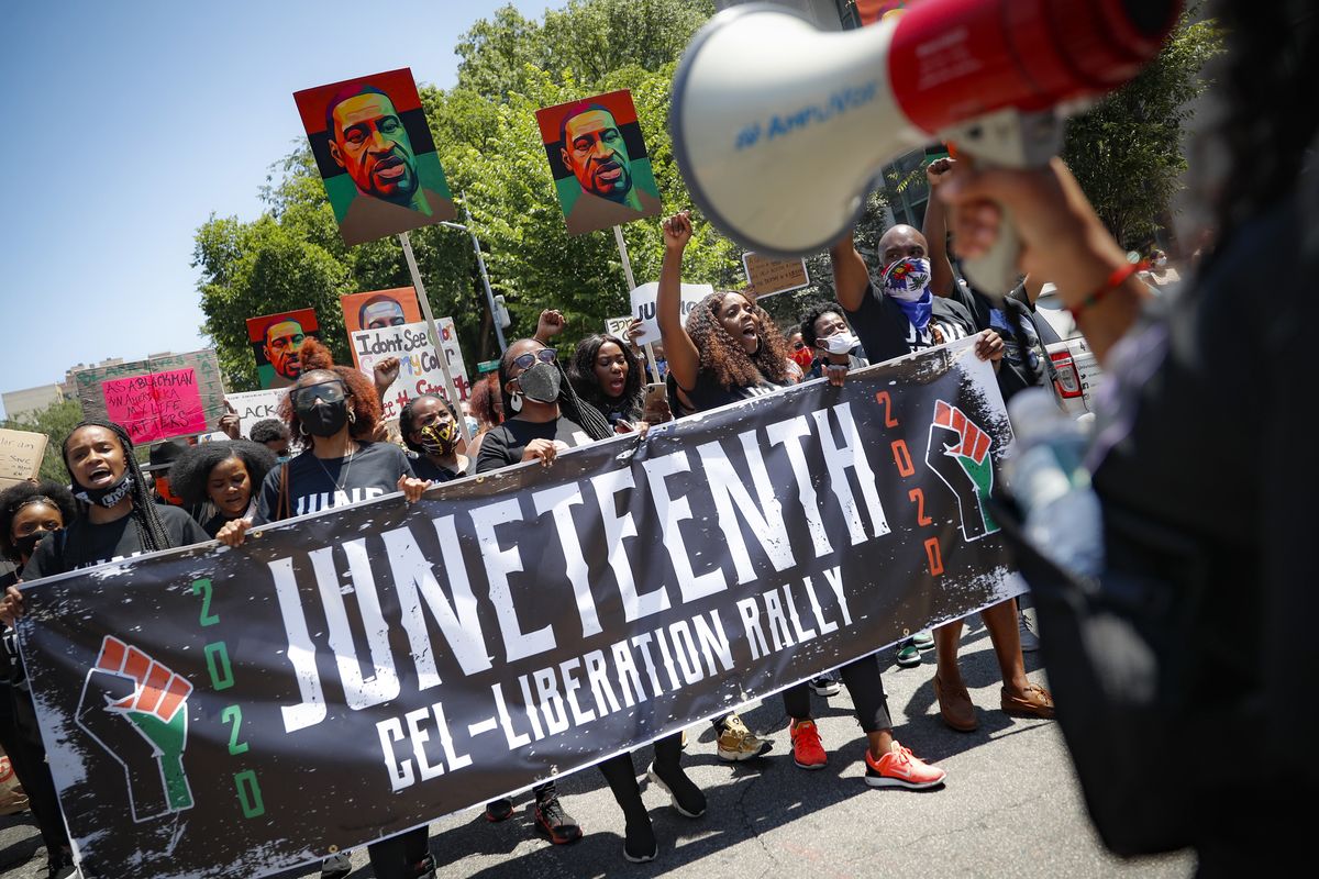 FILE- In this June 19, 2020, file photo, protesters chant as they march after a Juneteenth rally at the Brooklyn Museum, in the Brooklyn borough of New York.  (John Minchillo)