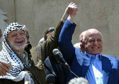 
Palestinian leader Yasser Arafat and his Prime Minister Ahmed Qureia, right, appear together following their cabinet meeting Tuesday in Arafat's headquarters. Palestinian leader Yasser Arafat and his Prime Minister Ahmed Qureia, right, appear together following their cabinet meeting Tuesday in Arafat's headquarters. 
 (Associated PressAssociated Press / The Spokesman-Review)