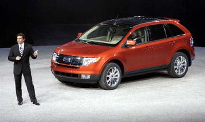 
Mark Fields, Ford executive vice president and president of the Americas introduces the 2007 Ford Edge crossover utility vehicle (CUV) at the North American International Auto Show iin Detroit. The vehicle has a 250-horsepower V-6 engine and 6-speed automatic transmission. 
 (Associated Press / The Spokesman-Review)
