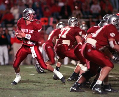 Washington State quarterback Drew Bledsoe drops back to pass against Utah in the Copper Bowl on Dec. 29, 1992, in Tucson, Arizona.  (The Spokesman-Review)