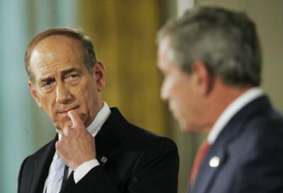 
Israeli Prime Minister Ehud Olmert, left, joins President Bush at a news conference  at the White House on Tuesday. The White House urged Olmert to reach out to the Palestinian president.
 (Associated Press / The Spokesman-Review)