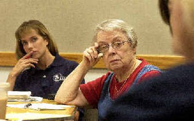 
Bridget Walsh, left, and Gratia Griffith, center, listen to Sue Manley Smith talk Wednesday about her work on domestic violence. 
 (Jesse Tinsley / The Spokesman-Review)